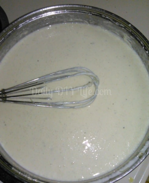 Add milk, a little at a time, whisking to smooth out lumps. 