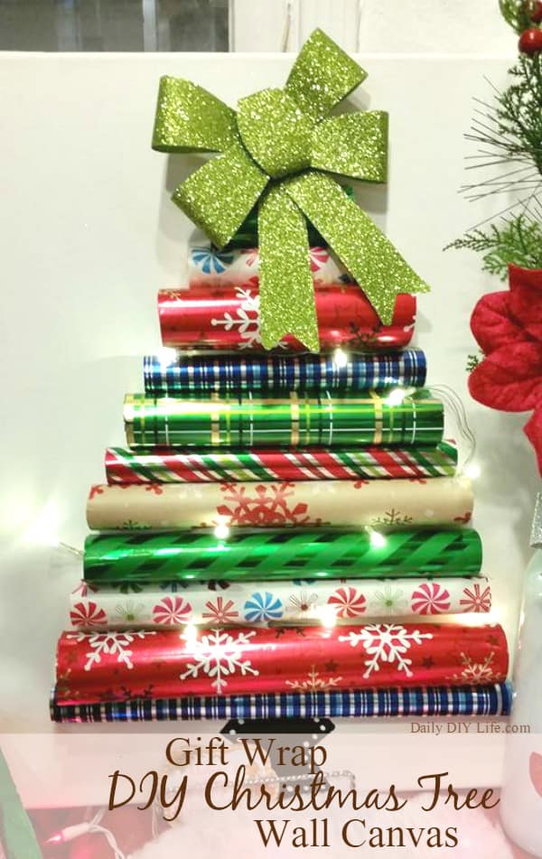 Gift Wrap DIY Christmas Tree Wall Canvas. If you are looking for a fun Christmas Project that is inexpensive to make and absolutely adorable, this one is it! Check it out! | DailyDIYLife.com