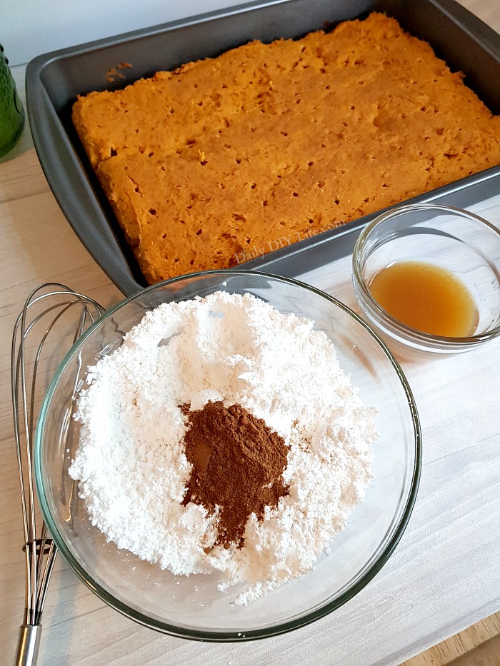 If you are looking for a simple moist and delicious Pumpkin Cake recipe with the wow factore, look no further! This flavorful, easy recipe uses only 2 basic ingredients! A fantastic fall dessert packed with tons of flavor. Kick up the sweetness a bit with a simple apple cider glaze. This two ingredient pumpkin cake will quickly become a family favorite. No one needs to know just how easy it is to make. #Desserts #FallDesserts #PumpkinDesserts #DumpCake #PumpkinDumpCake #EasyDessertRecipes #EasyFallDesserts #PumpkinSpice #PumkinSpiceDessert 