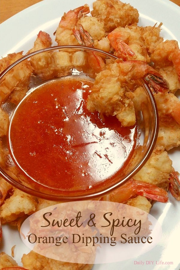 The BEST Coconut Shrimp I have ever made! Served with a sweet and spicy orange dipping sauce. Crunchy, sweet and delicious every time! | DailyDIYLife.com