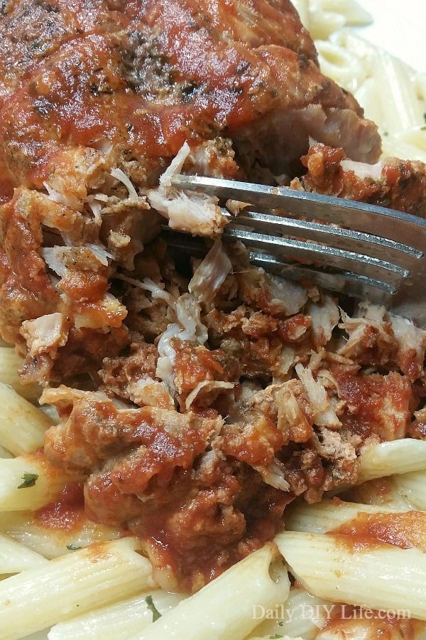 Italian Style Smothered Pork Roast! A crock pot recipe that will please a crowd. Savory sauce and buttery noodles are perfect every time. https://DailyDIYLife.com