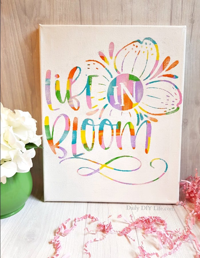 From hot mess to beautiful art! This Hot Mess Canvas project is quick, easy and turns out beautiful and unique every time. With a little help from your Cricut cutting machine, the possibilities are endless. A great gift for everyone on your list! #CricutMade #CraftAndCreateWithCricut #CricutCrafts #HotMessCanvas