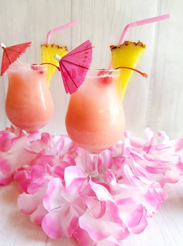 If you are a fan of the classic Blue Hawaiian Cocktail, you are going to love our version of the PINK Hawaiian. The same tasty sweet tropical flavors that you love, with a very pink twist. Everything is better in pink! #Cocktails #CocktailRecipe #BlueHawaiian @PinkHawaiian #Tropical #TropicalDrinks #IslandDrinks #BetterInPink