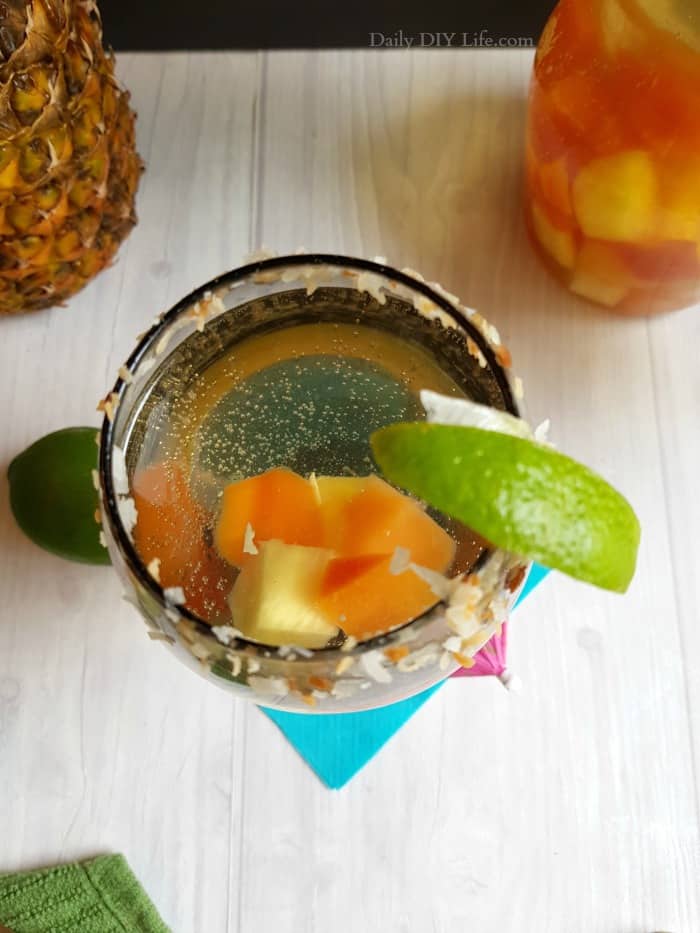 Tropical Sangria infused with refreshing pineapple coconut water is the perfect cocktail for those warm summer nights. Refreshing, crisp and full of your favorite tropical fruits. This sangria will transport your brain right to the islands. #SummerCocktails #Sangria #TropicalSangria #Wine #WineCocktail #TropicalDrinks