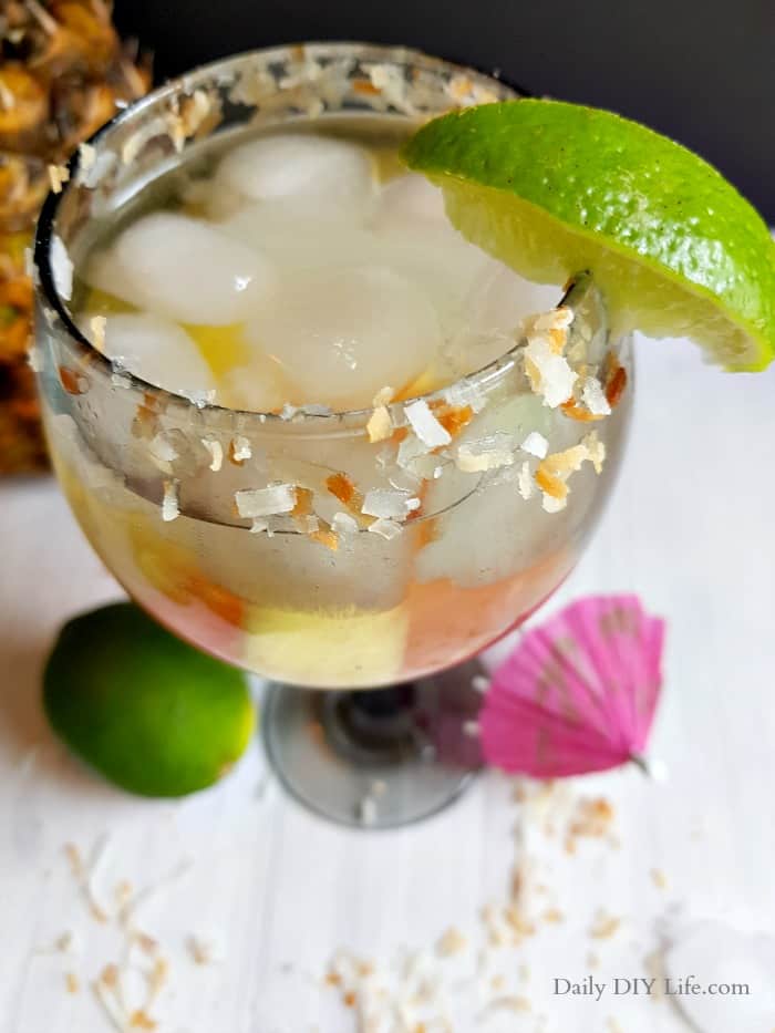 Tropical Sangria infused with refreshing pineapple coconut water is the perfect cocktail for those warm summer nights. Refreshing, crisp and full of your favorite tropical fruits. This sangria will transport your brain right to the islands. #SummerCocktails #Sangria #TropicalSangria #Wine #WineCocktail #TropicalDrinks