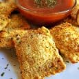 This easy air fryer recipe for Fried Ravioli is the perfect appetizer for your next party or dinner menu. Best of all it takes just 15 minutes. These crispy little treats are packed with flavor and is sure to satisfy a crowd. Make up a batch today with this easy 15 minute recipe. #AirFryer #AirFryerRecipe #Nuwave #NuwaveAirFryer #ItalianRecipes #RavioliRecipe #FriedRavioli #Homemade #Food #EasyAppetizers
