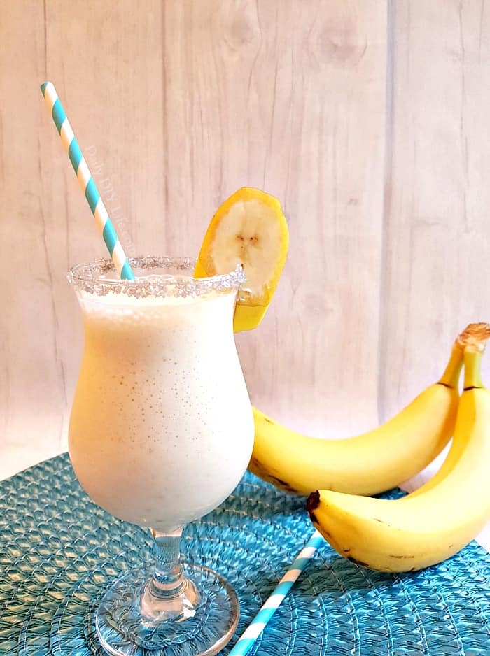 The Dirty Banana Cocktail! A creamy, frothy cocktail that is full of great banana flavor and perfect for poolside sipping. You can easily make this a Mocktail for the kids by replacing the alcohol with coffee or chocolate syrup. #Cocktails #CocktailRecipe #TropicalCocktails #Mocktail #BananaRecipe #BananaCocktail