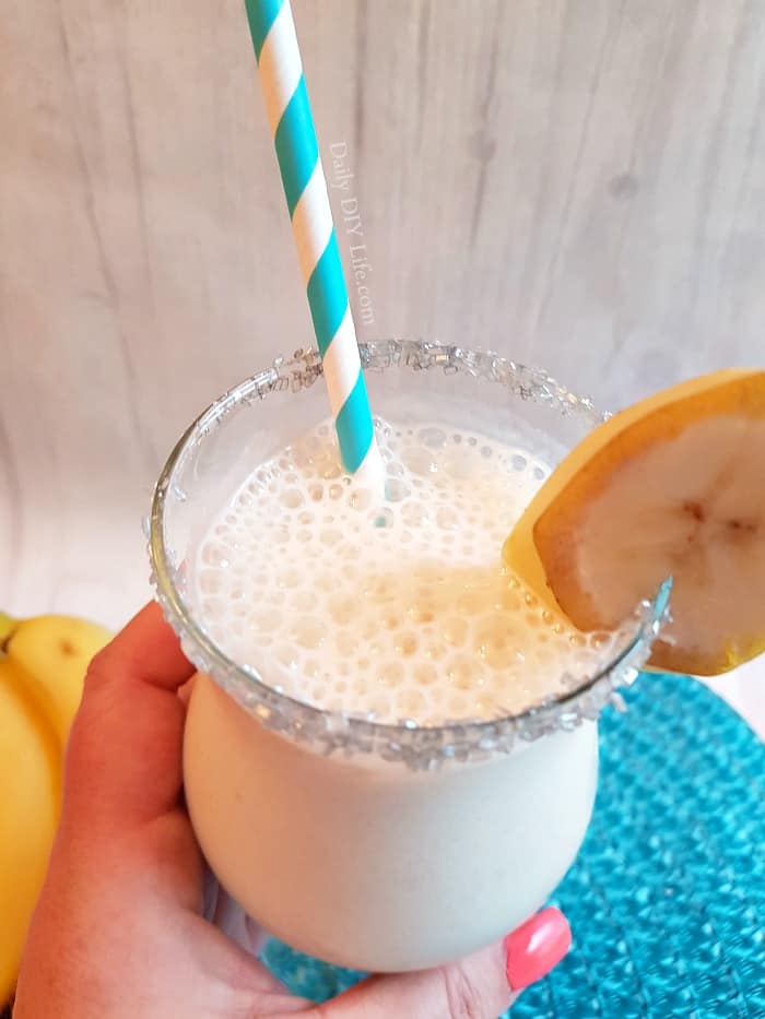 The Dirty Banana Cocktail! A creamy, frothy cocktail that is full of great banana flavor and perfect for poolside sipping. You can easily make this a Mocktail for the kids by replacing the alcohol with coffee or chocolate syrup. #Cocktails #CocktailRecipe #TropicalCocktails #Mocktail #BananaRecipe #BananaCocktail