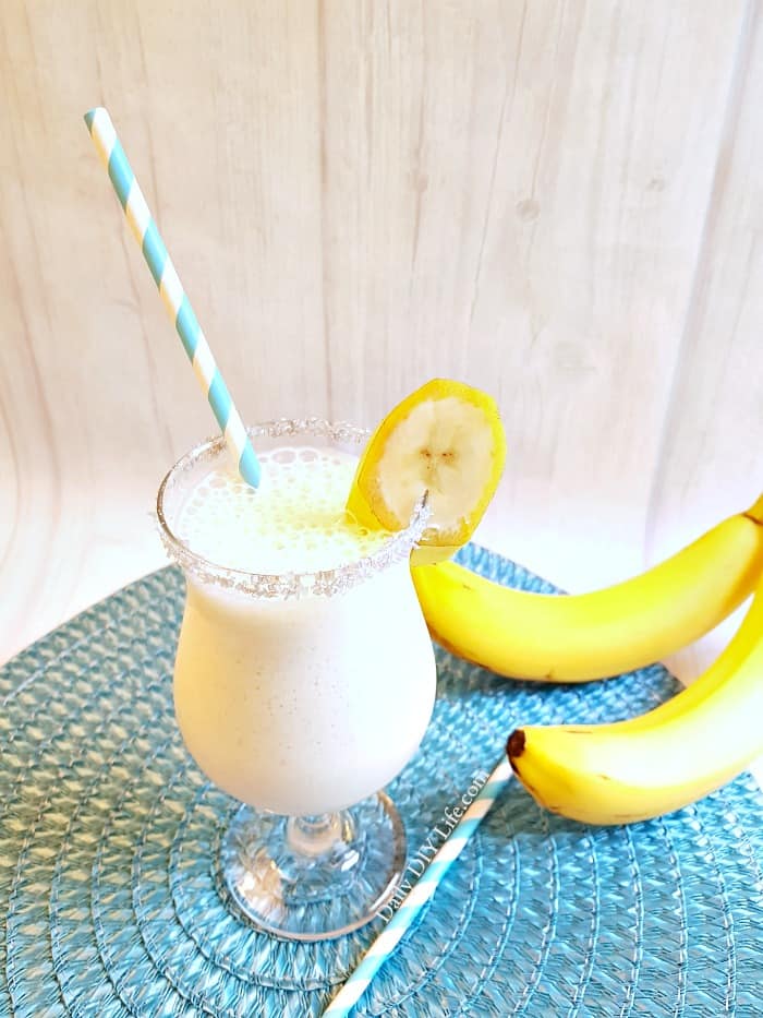 The Dirty Banana Cocktail! A creamy, frothy cocktail that is full of great banana flavor and perfect for poolside sipping. You can easily make this a Mocktail for the kids by replacing the alcohol with coffee or chocolate syrup. #Cocktails #CocktailRecipe #TropicalCocktails #Mocktail #BananaRecipe #BananaCocktail