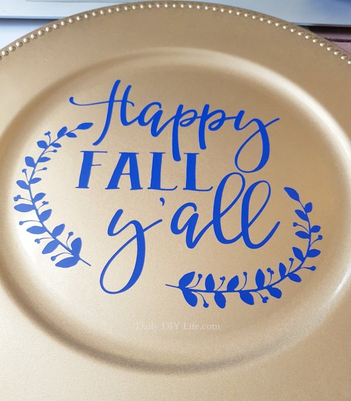 This Easy Fall Decor Project is the perfect piece to add to your Fall decorating. Using a Dollar Tree charger, silk flowers and your Cricut, you can create a custom design that will match your own design style. This beautiful piece can be done in less than a day from start to finish. #CricutMade #CraftAndCreateWithCricut #Cricut #Vinyl #VinylStencil #DIYFall #FallDecor #FallDecorating