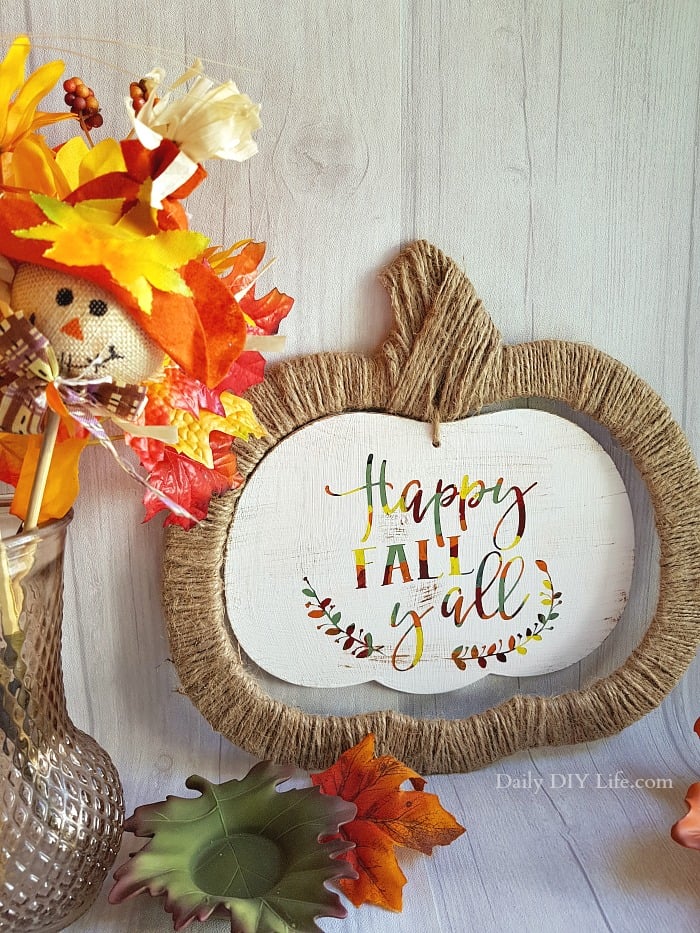 Who doesn't love a good Dollar Store Upcycle? These cute Halloween signs made the perfect canvas for a colorful, rustic Fall wall hanging. Using your Cricut and the Hot Mess Canvas Method, you can transform a cheap dollar store sign into an adorable hanging sign that is perfect for your Fall decor. #Cricutmade #CraftAndCreateWithCricut #Fall #FallDecor #CricutCrafts #HotMessCanvas #Art #Cricut #PaintCrafts