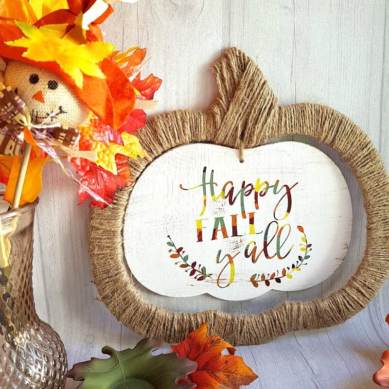 Who doesn't love a good Dollar Store Upcycle? These cute Halloween signs made the perfect canvas for a colorful, rustic Fall wall hanging. Using your Cricut and the Hot Mess Canvas Method, you can transform a cheap dollar store sign into an adorable hanging sign that is perfect for your Fall decor. #Cricutmade #CraftAndCreateWithCricut #Fall #FallDecor #CricutCrafts #HotMessCanvas #Art #Cricut #PaintCrafts