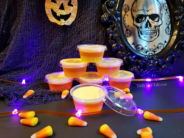 Grown-ups need a trick or treat too! These Candy Corn Jello Shots are a whimsical treat for the adults looking to bring out their inner child. Sweet, strong and potent, just the right kick for all the grown-ups this Halloween. Enjoy Responsibly! #Cocktails #FallCocktails #CandyCornDrinks #JelloShots #AdultBeverages #HalloweenCocktails