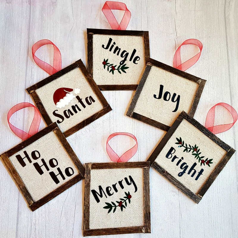 Add a touch of farmhouse style to your holiday decor with these easy to assemble Mini Reverse Canvas Ornaments. Using your Cricut cutting machine and a few supplies you probably already have around the house, you can put these adorable ornaments together in no time. They are completely customizable too! #CraftAndCreateWithCricut #CricutMade #Cricut #DIYChristmas #ChristmasOrnaments #DIYChristmasOrnaments #FarmhouseChristmas