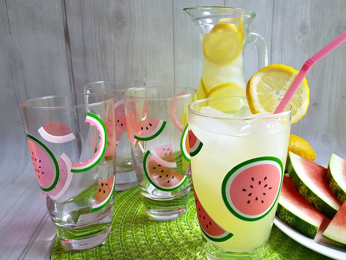 Add A Splash Of Fun To Your Summertime Table With These Colorful Watermelon Glasses. Using transparent vinyl from StyleTech Craft and your Cricut cutting machine, you can have this adorable DIY summer glassware set finished in no time. I am so in love with these watermelon drinking glasses, I may have to use them all year long.  #Sponsored #StyleTechCraft #StyleTech #CricutMade #Cricut #SummerCrafts #VinylCrafts #WatermelonCrafts