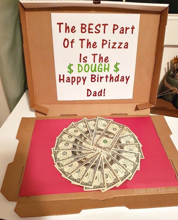 Making the perfect DIY Money Gift for the person that has everything is not only fun and easy, it is also a really cool way to give the gift of cash in a unique way. A few basic supplies, some dollar bills and a little bit of your time and you have a creative gift that everyone will want to receive. You can't go wrong with cash, am I right? #StyleTechCraft #StyleTechCraftVinyl #GlossyVinyl #CricutMade #Cricut #MoneyGiftIdea #DIYGiftIdeas #DIYPizza #DIYVinylCraft #MoneyGiftIdeas