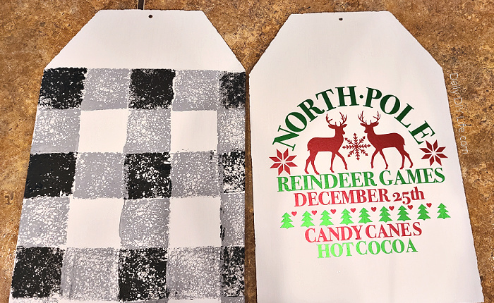 Whimsical oversized gift tags from the dollar tree are transformed into a beautiful Christmas Door Hanger with a little paint and shimmering luster vinyl. This is an easy holiday craft that can be made using your Cricut cutting machine and StyleTech Craft luster vinyl. #Sponsored #StyleTechCraft #StyleTech #LusterVinyl #CricutMade #CricutChristmas #VinylChristmasCrafts #ChristmasDollarTree