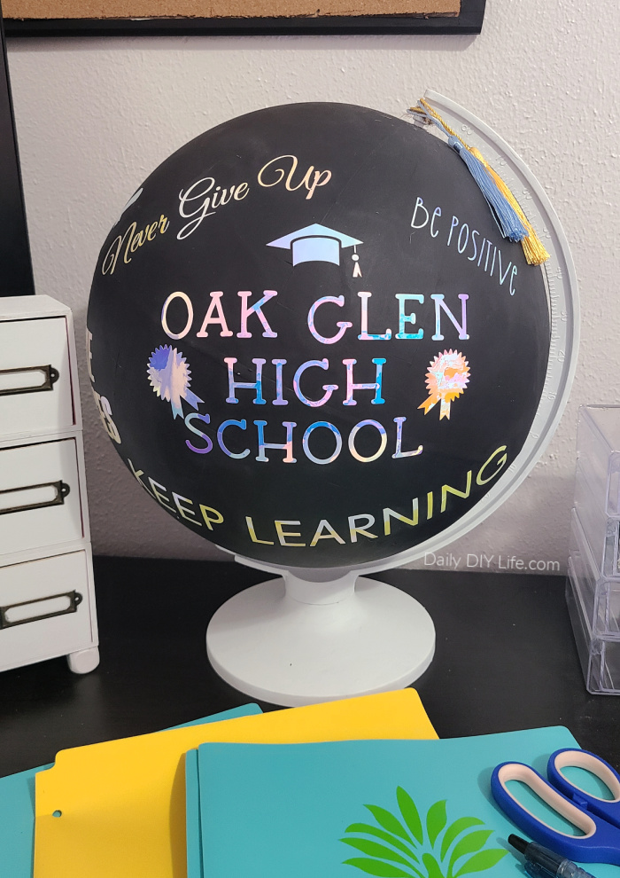 An inspirational graduation gift that is sure to wow the recipient. This easy DIY upcycle uses a thrift store globe, chalk paint, and gorgeous Opal Vinyl from StyleTech Craft in the school colors. Personalized graduation gifts are thoughtful, meaningful, and full of wonderful memories. #Sponsored #StyleTechCraft #OpalVinyl #DIYGraduationGift #GraduationGift #ThriftedUpcycle #GlobeCrafts #CricutMade #Cricut