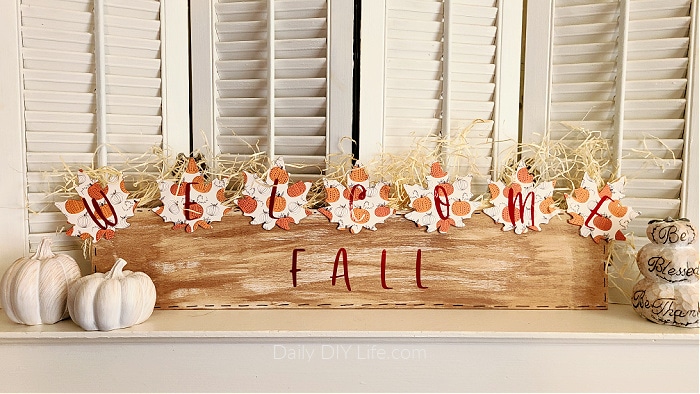 This Colorful Fall Welcome Sign can be made using rustic scrap wood and shimmering luster vinyl from StyleTech Craft. Fall decor should be comforting and cozy to match your home. The contrast of the rustic wood and the shine from the luster vinyl is the perfect pairing for the joys of the fall season. #Sponsored #StyleTechCraft #StyleTechVinyl #LusterVinyl #CricutMade #Cricut #FallDecor #FallDIY #ModPodge #FallModPodge