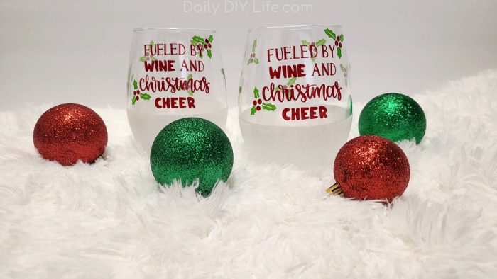 Glitter Holiday Wine Glasses are the perfect addition to your holiday table decor. Holiday glassware that is not only charming and special but also personal and customizable with any theme you would like. #sponsored #styletechcraft #vinyl #diyglitter #cricutmade #cricut #glittervinyl #winecrafts