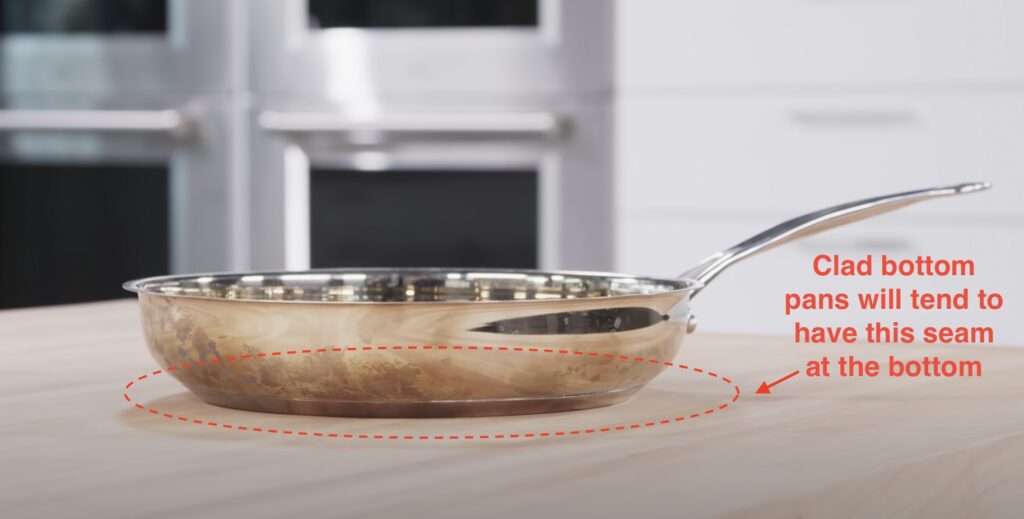 Image of clad bottom fry pan with the clad bottom circled