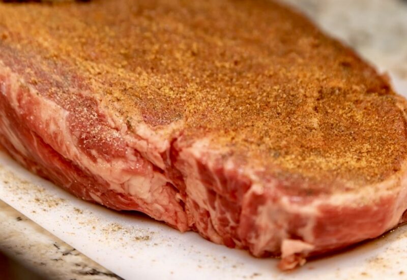 raw steak with dry rub - copycat texas roadhouse steak