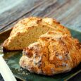 loaf of Irish soda bread with a slice removed