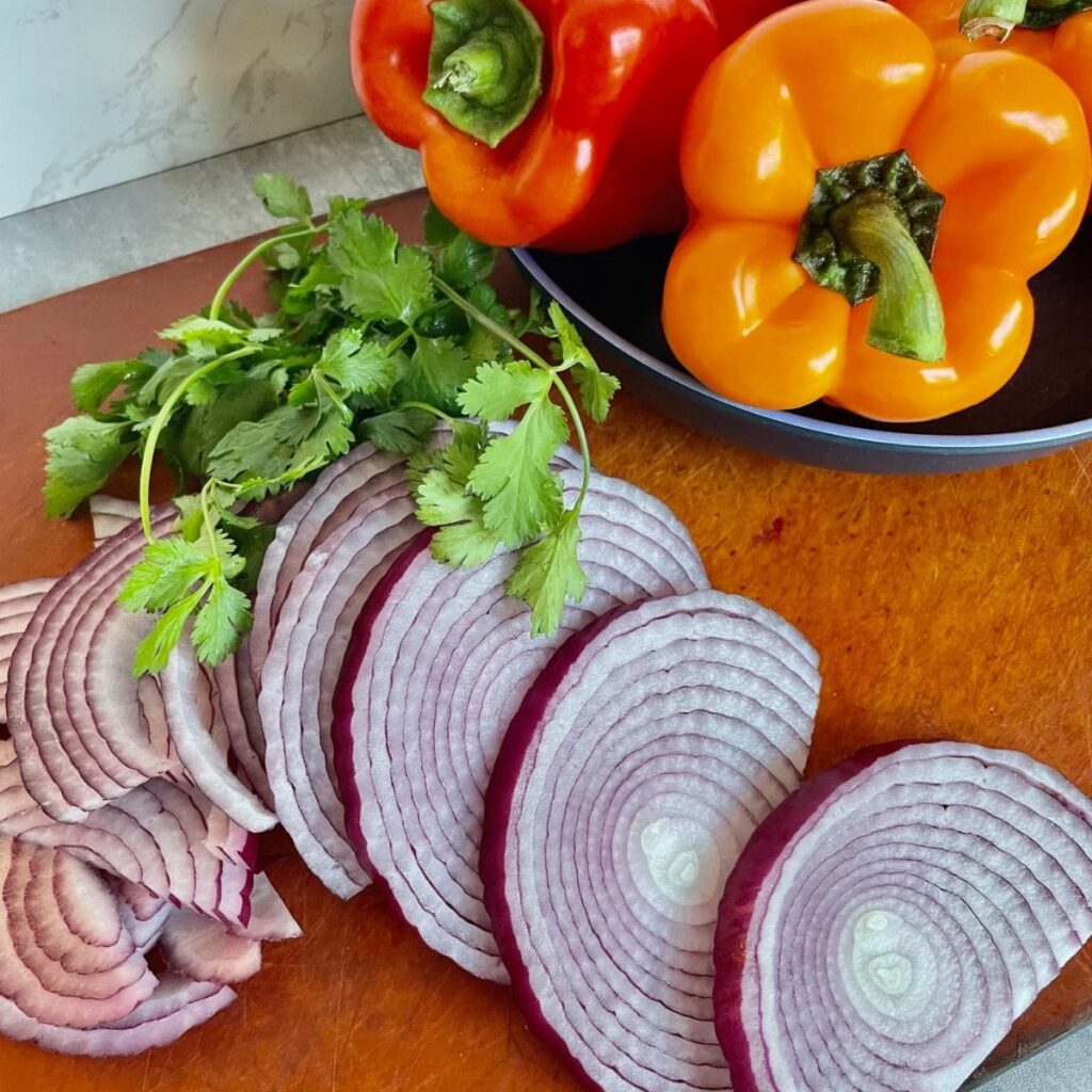 raw peppers and onions for chipotle fajita veggies