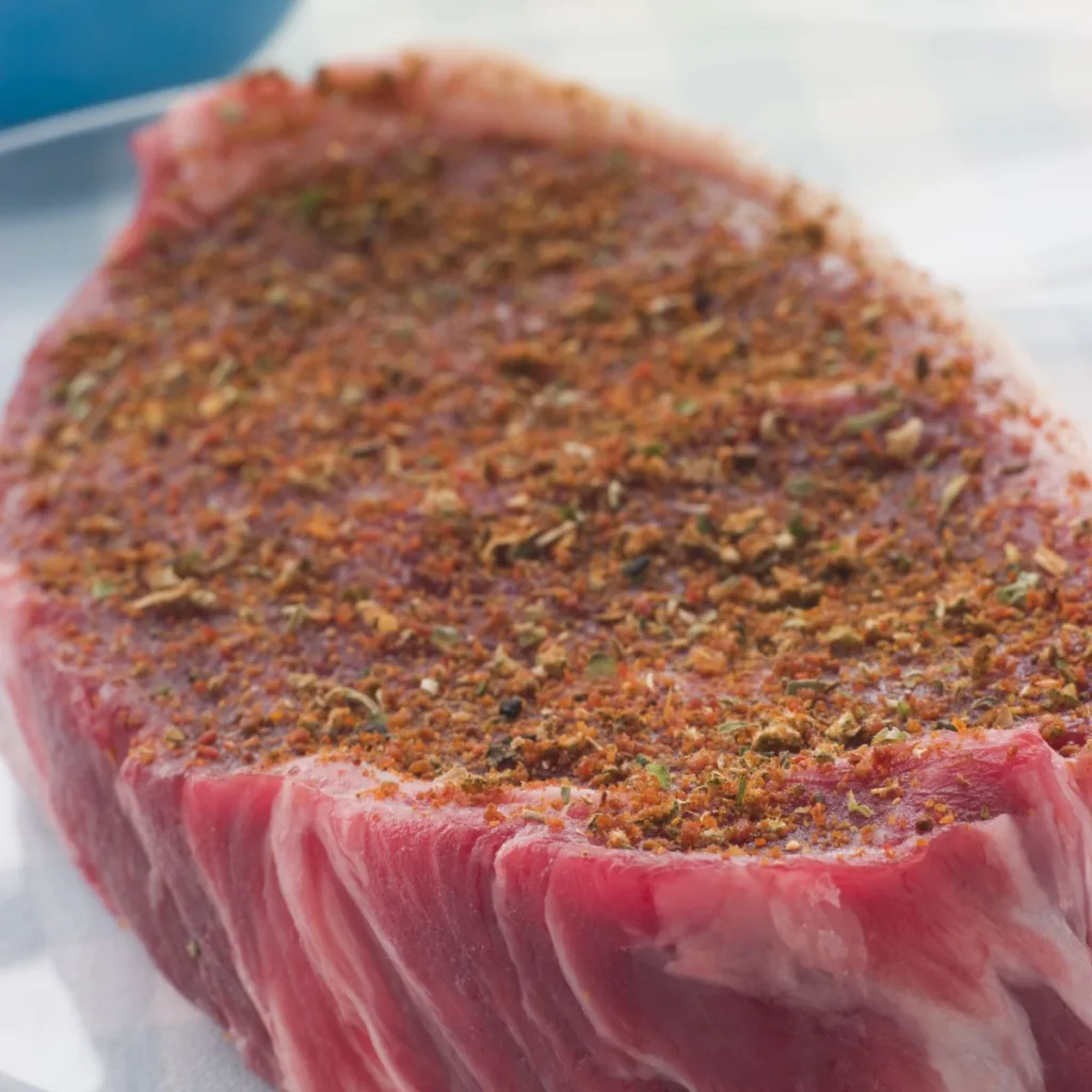 raw steak with dry rub
