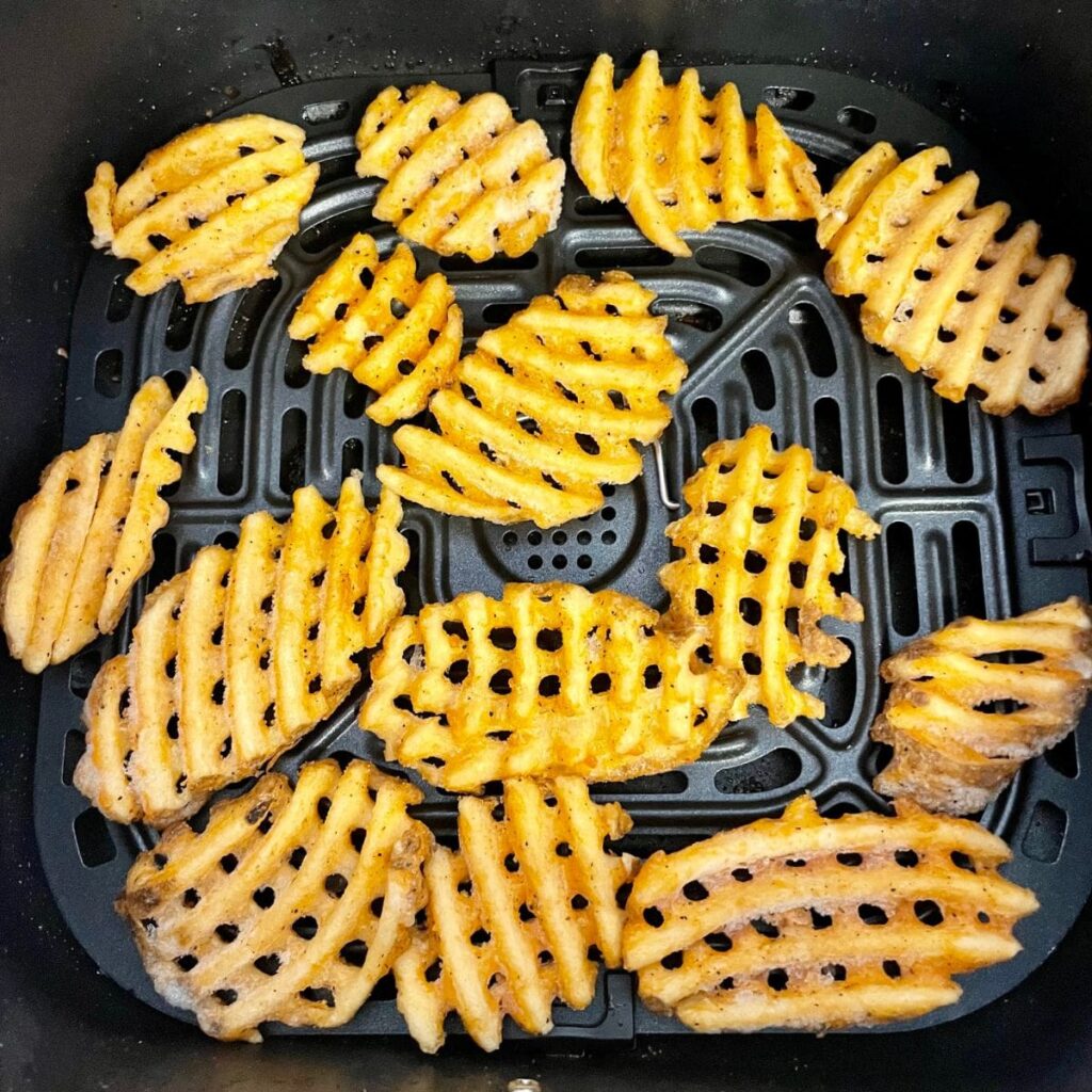 frozen waffles fries in an air fryer basket