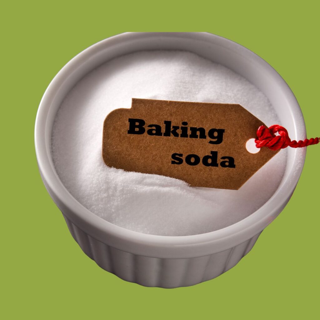 bowl of baking soda on green background