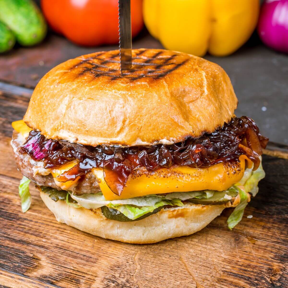 burger with caramelized red onions on it