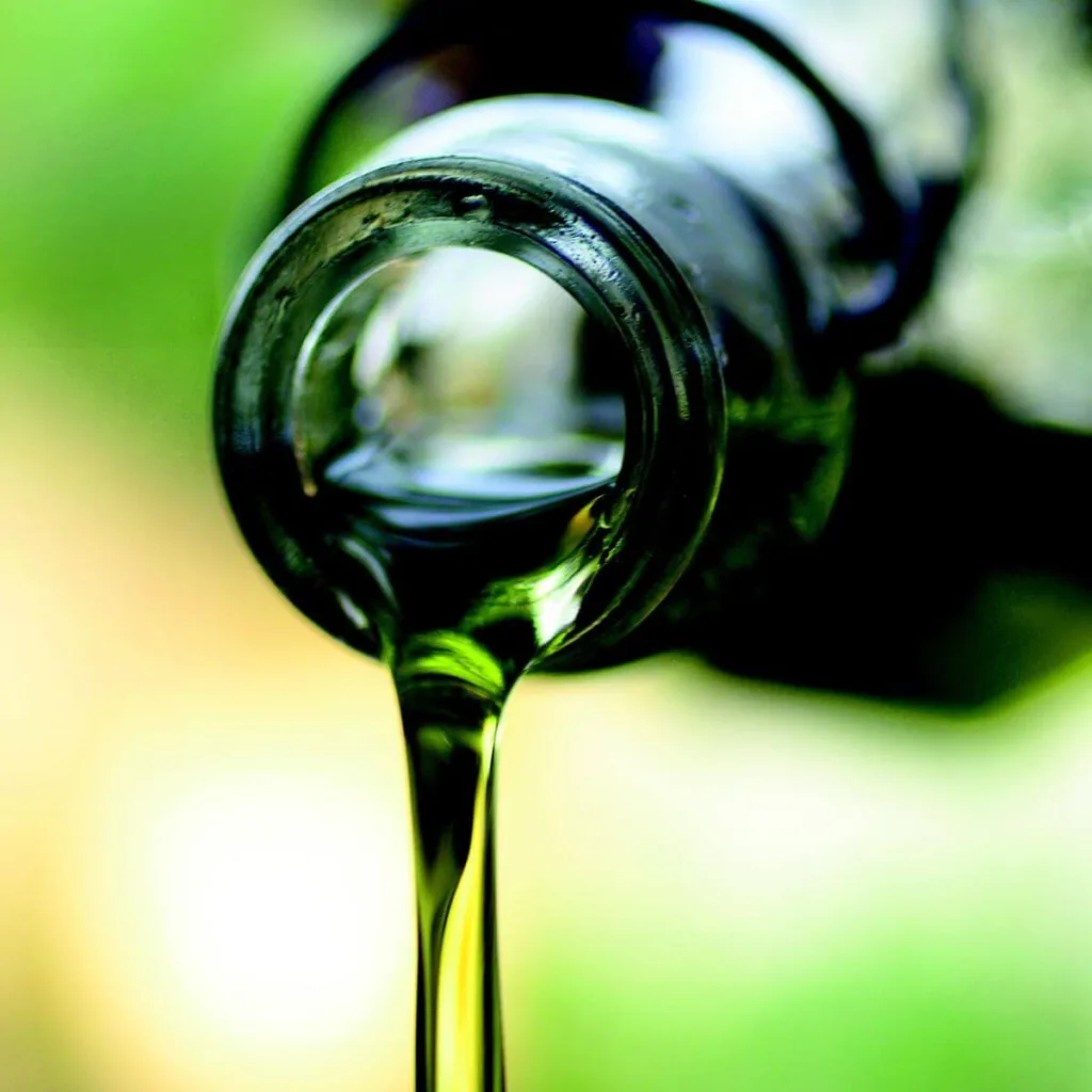 olive oil being poured from a bottle