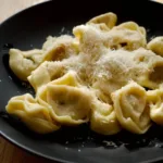 bowl tortellini with shaved cheese