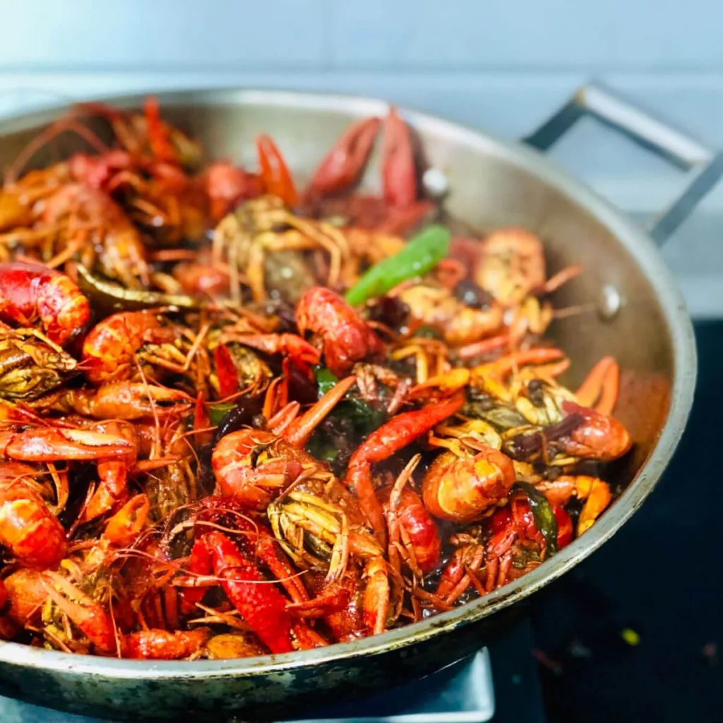 skillet of sauteed prawns